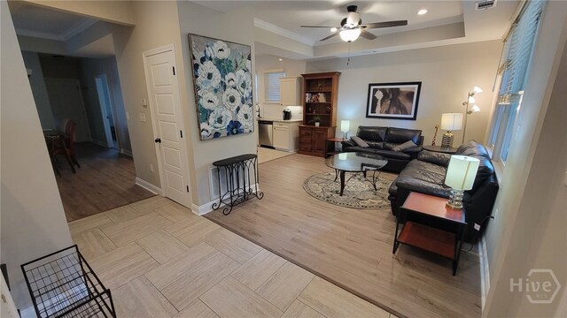 856 E 35th St, Savannah, GA 31401 - living room featuring a raised ceiling, ceiling fan, light wood finished floors, crown molding, and recessed lighting