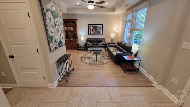 856 E 35th St, Savannah, GA 31401 - living room with wood finished floors, a ceiling fan, ornamental molding, and a raised ceiling