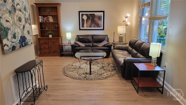 856 E 35th St, Savannah, GA 31401 - living area with light wood-style floors and baseboards