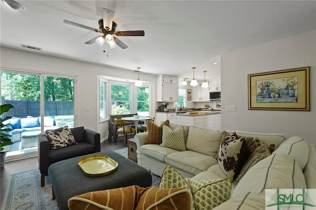 living area featuring visible vents, wood finished floors, ceiling fan, and recessed lighting