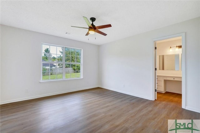 4 Tantallon Ct, Pooler, GA 31322 - unfurnished bedroom featuring baseboards, ceiling fan, visible vents, and wood finished floors