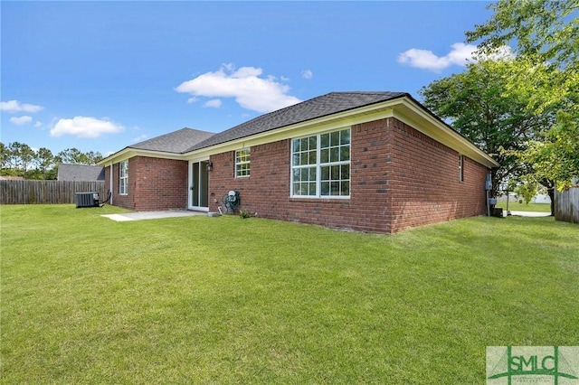 4 Tantallon Ct, Pooler, GA 31322 - rear view of property featuring central AC unit, fence, brick siding, and a lawn