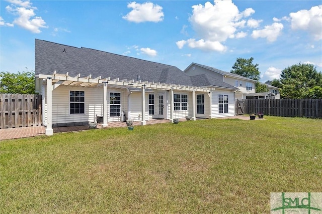 back of property with a lawn, a patio area, a pergola, roof with shingles, and a fenced backyard