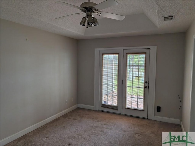 interior space with baseboards, carpet flooring, visible vents, and a textured ceiling