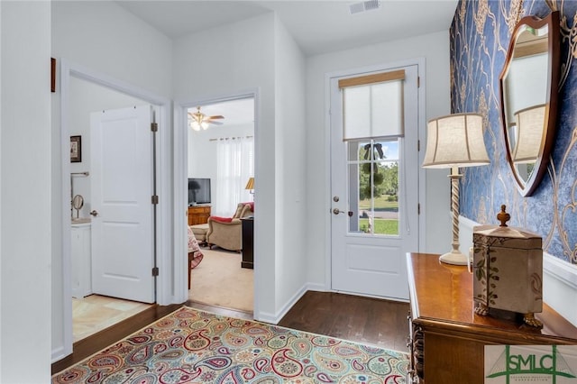 20 Baraco Dr, Savannah, GA 31419 - foyer featuring wallpapered walls, baseboards, visible vents, and wood finished floors