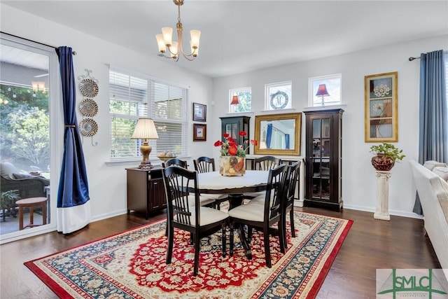 20 Baraco Dr, Savannah, GA 31419 - dining space featuring baseboards, an inviting chandelier, and dark wood-type flooring
