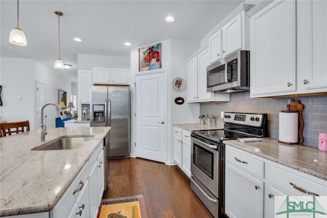 20 Baraco Dr, Savannah, GA 31419 - kitchen with a sink, tasteful backsplash, white cabinets, and appliances with stainless steel finishes