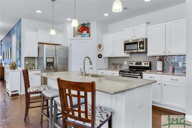 20 Baraco Dr, Savannah, GA 31419 - kitchen with white cabinetry, decorative backsplash, stainless steel appliances, and a sink