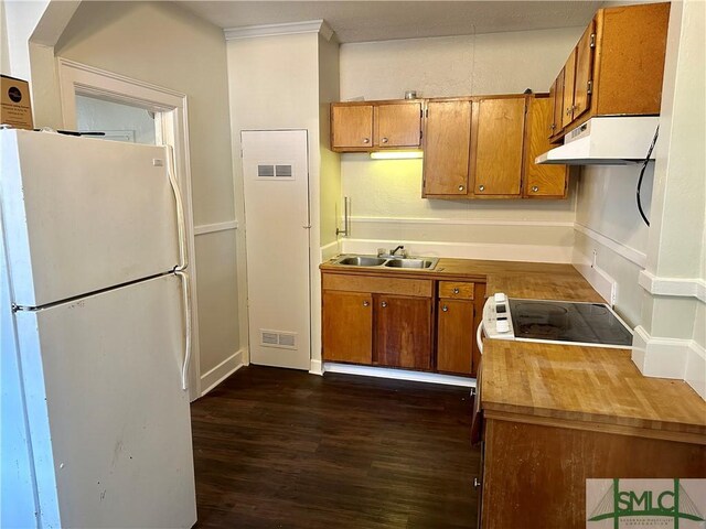 1020 Maupas Ave, Savannah, GA 31401 - kitchen featuring freestanding refrigerator, a sink, brown cabinetry, dark wood-style flooring, and under cabinet range hood