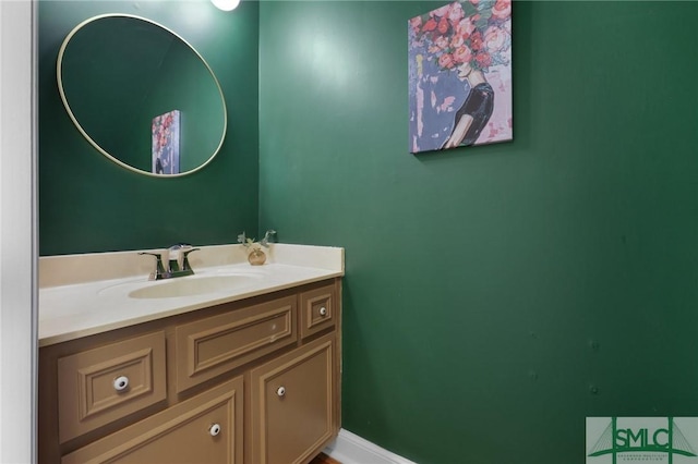 bathroom featuring vanity and baseboards
