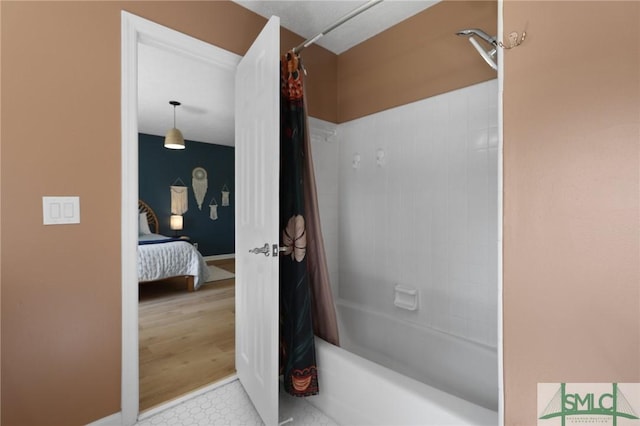 bathroom with shower / tub combo with curtain and connected bathroom