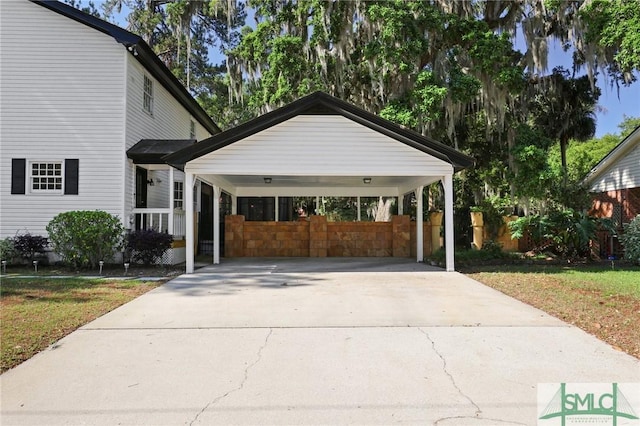 view of front of home featuring driveway and fence