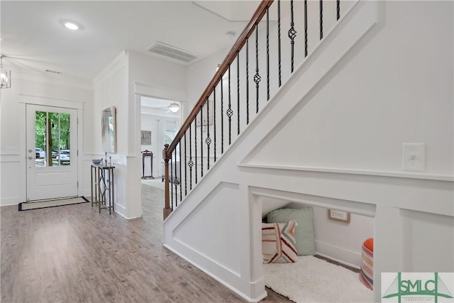 195 Wildlife View Ct N, Richmond Hill, GA 31324 - entryway featuring wood finished floors, stairway, a ceiling fan, ornamental molding, and baseboards