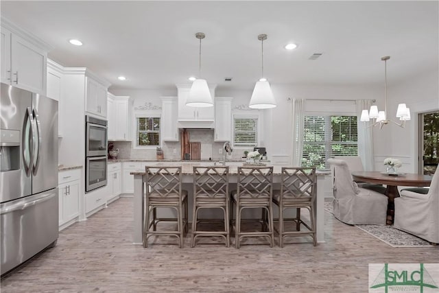195 Wildlife View Ct N, Richmond Hill, GA 31324 - kitchen with appliances with stainless steel finishes, healthy amount of natural light, white cabinetry, light wood-style flooring, and recessed lighting