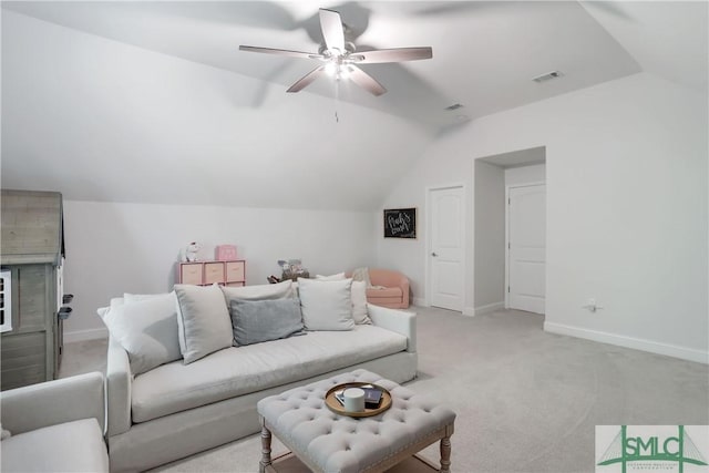 195 Wildlife View Ct N, Richmond Hill, GA 31324 - living room with lofted ceiling, light colored carpet, a ceiling fan, and baseboards