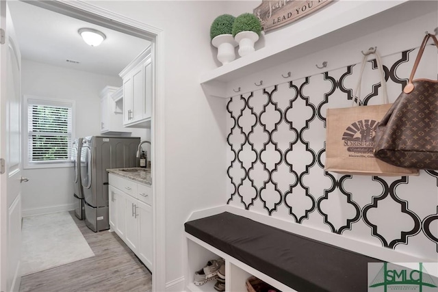 195 Wildlife View Ct N, Richmond Hill, GA 31324 - mudroom with washing machine and dryer, light wood finished floors, a sink, and baseboards