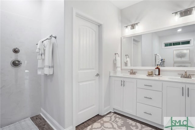 195 Wildlife View Ct N, Richmond Hill, GA 31324 - full bath featuring wood finished floors, double vanity, and a shower