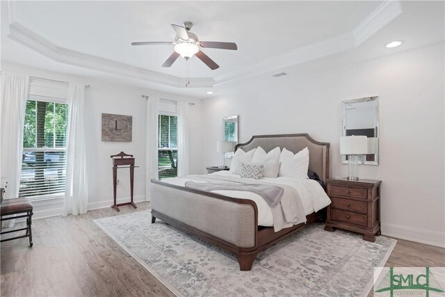 195 Wildlife View Ct N, Richmond Hill, GA 31324 - bedroom featuring a raised ceiling, wood finished floors, crown molding, baseboards, and recessed lighting