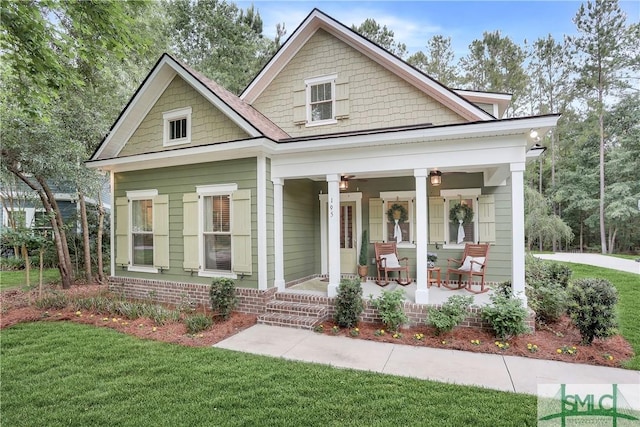 195 Wildlife View Ct N, Richmond Hill, GA 31324 - view of front of home featuring covered porch and a front yard