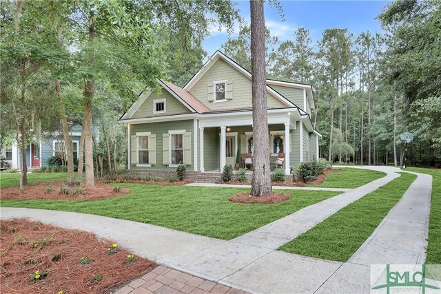 195 Wildlife View Ct N, Richmond Hill, GA 31324 - view of front of house featuring a porch and a front yard
