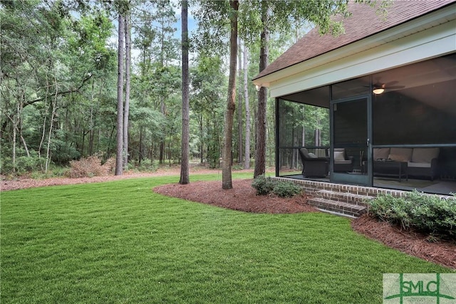 195 Wildlife View Ct N, Richmond Hill, GA 31324 - view of grassy yard featuring a sunroom and ceiling fan