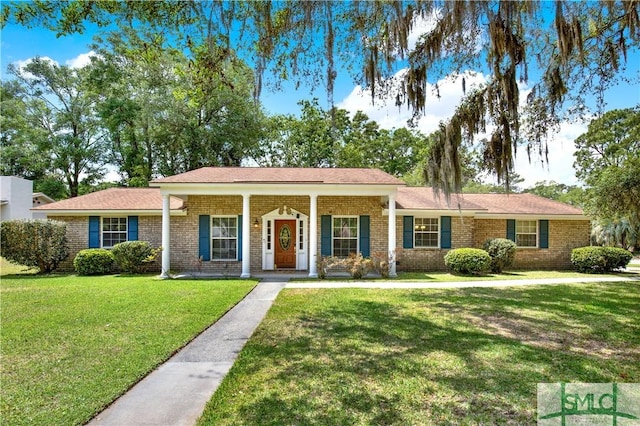 ranch-style home with a front lawn and brick siding