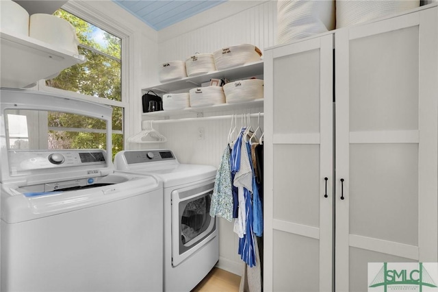 laundry area with washing machine and dryer