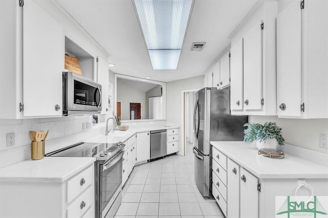 11 Fat Friars Retreat Retreat, Savannah, GA 31411 - kitchen with stainless steel appliances, white cabinetry, a sink, light countertops, and light tile patterned floors