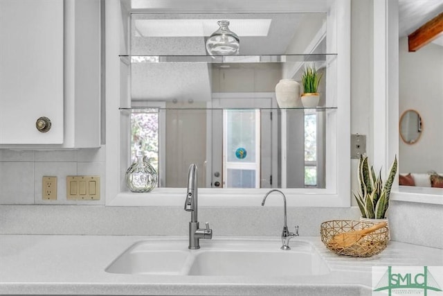 11 Fat Friars Retreat Retreat, Savannah, GA 31411 - kitchen featuring a sink, light countertops, tasteful backsplash, and white cabinetry