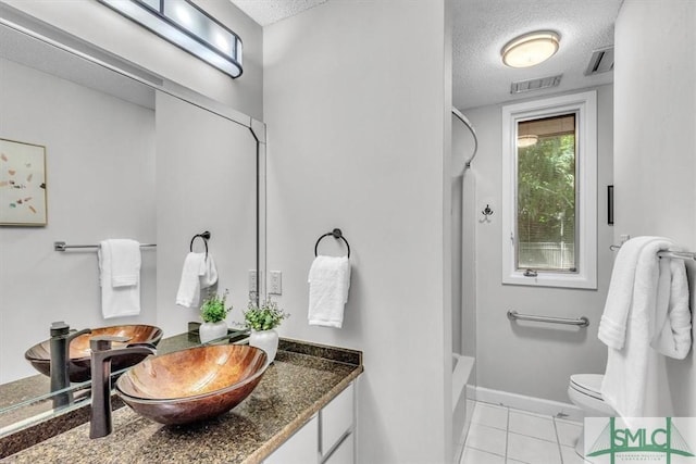 11 Fat Friars Retreat Retreat, Savannah, GA 31411 - bathroom featuring a textured ceiling, tile patterned flooring, vanity, toilet, and shower / tub combination