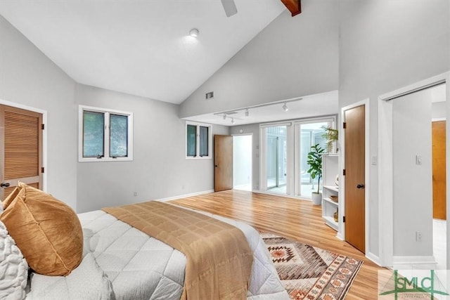 11 Fat Friars Retreat Retreat, Savannah, GA 31411 - bedroom featuring light wood-style floors, track lighting, access to outside, baseboards, and high vaulted ceiling