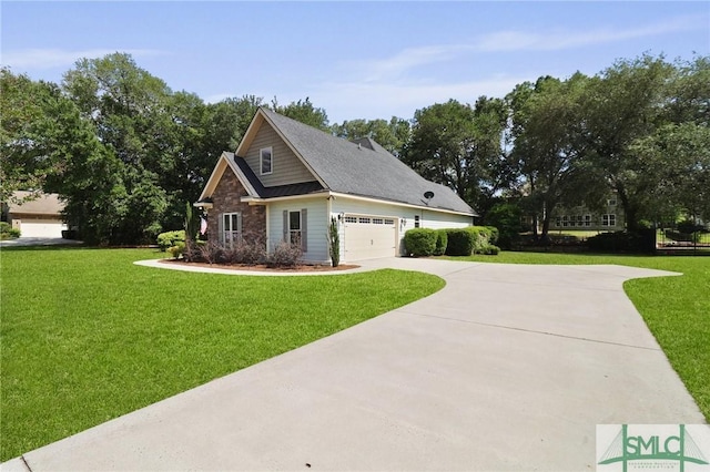 craftsman house featuring a front yard, concrete driveway, and a garage