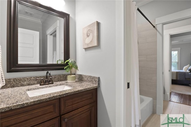 full bath with vanity, shower / bathtub combination with curtain, and ornamental molding