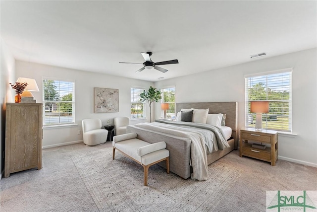 89 Evan Wade Ct NE, Ludowici, GA 31316 - carpeted bedroom with multiple windows, baseboards, and ceiling fan