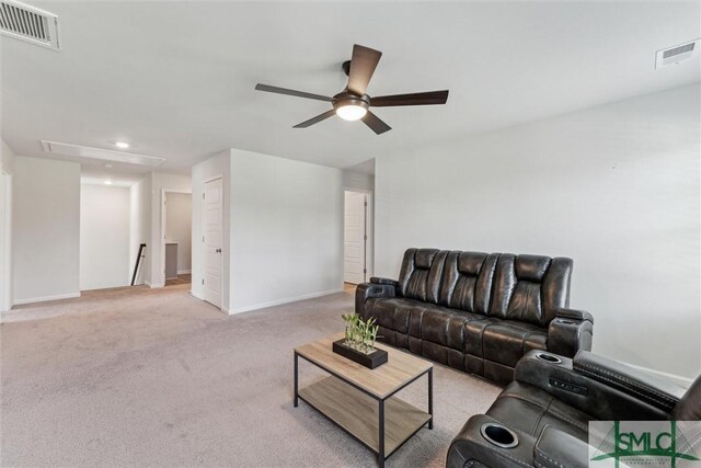 89 Evan Wade Ct NE, Ludowici, GA 31316 - living area with attic access, a ceiling fan, light colored carpet, baseboards, and recessed lighting