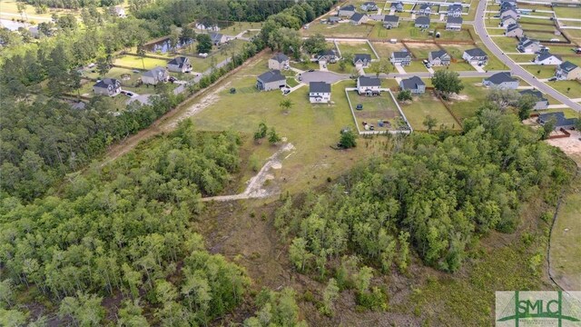 89 Evan Wade Ct NE, Ludowici, GA 31316 - aerial view of property and surrounding area featuring nearby suburban area