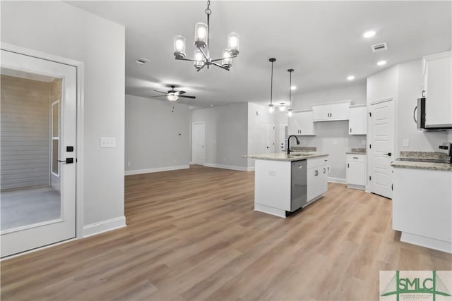 333 Crosswinds Dr, Rincon, GA 31326 - kitchen featuring stainless steel dishwasher, ceiling fan, white cabinetry, a sink, and a chandelier