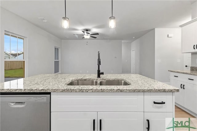 333 Crosswinds Dr, Rincon, GA 31326 - kitchen featuring stainless steel dishwasher, a sink, ceiling fan, white cabinets, and hanging light fixtures