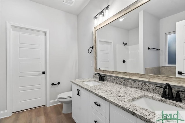 333 Crosswinds Dr, Rincon, GA 31326 - full bath featuring toilet, wood finished floors, a shower, and double vanity