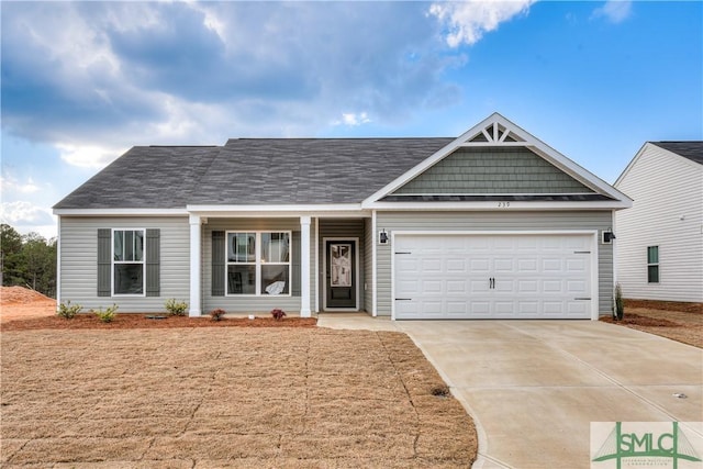 288 Timberlake Dr, Guyton, GA 31312 - view of front of property with driveway, a garage, and a porch