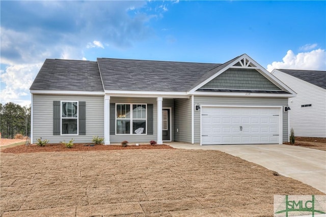 288 Timberlake Dr, Guyton, GA 31312 - view of front facade with concrete driveway, an attached garage, and covered porch