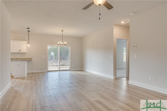 288 Timberlake Dr, Guyton, GA 31312 - unfurnished living room with ceiling fan, light wood-style floors, and baseboards