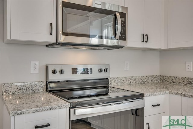 288 Timberlake Dr, Guyton, GA 31312 - kitchen featuring stainless steel appliances, white cabinetry, and light stone counters