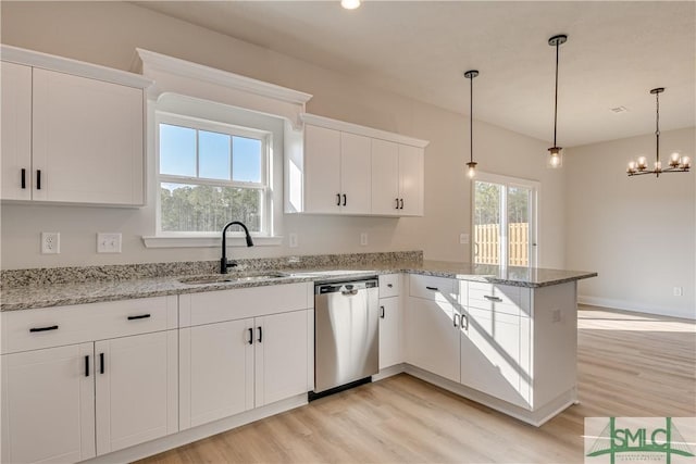 288 Timberlake Dr, Guyton, GA 31312 - kitchen featuring dishwasher, a sink, light wood-style flooring, a peninsula, and white cabinetry