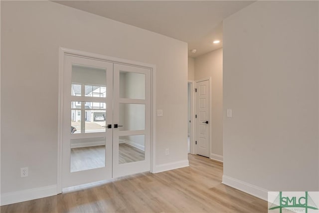 288 Timberlake Dr, Guyton, GA 31312 - spare room with light wood-style floors, french doors, baseboards, and recessed lighting