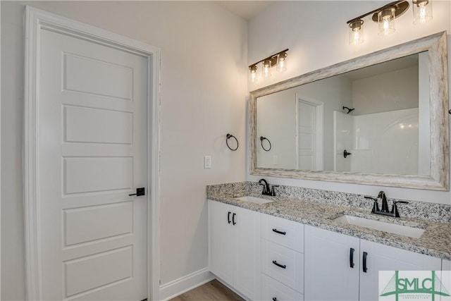 288 Timberlake Dr, Guyton, GA 31312 - full bath featuring double vanity, baseboards, and a shower