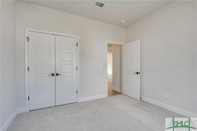 288 Timberlake Dr, Guyton, GA 31312 - unfurnished bedroom featuring carpet flooring, baseboards, and a closet