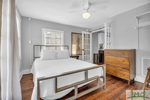 bedroom with french doors, wood finished floors, and ceiling fan