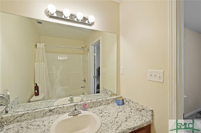 bathroom with vanity and shower / bath combo
