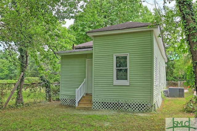 view of outbuilding with entry steps and central AC
